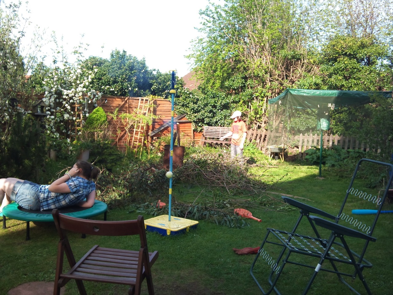 Eric, poking a garden fire with a stick